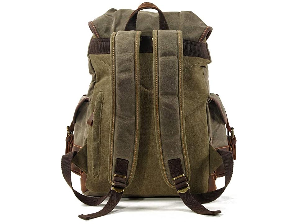 Back of an army green waxed canvas backpack showing padded shoulder straps and a carry handle
