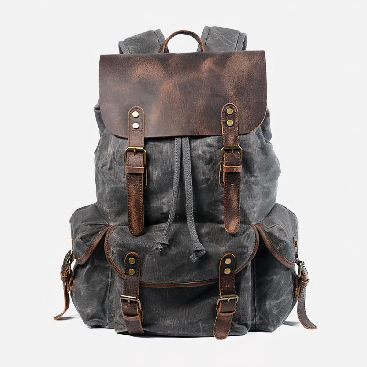 Front of gray waxed canvas backpack with leather flap, twin buckle straps and three outer pockets.