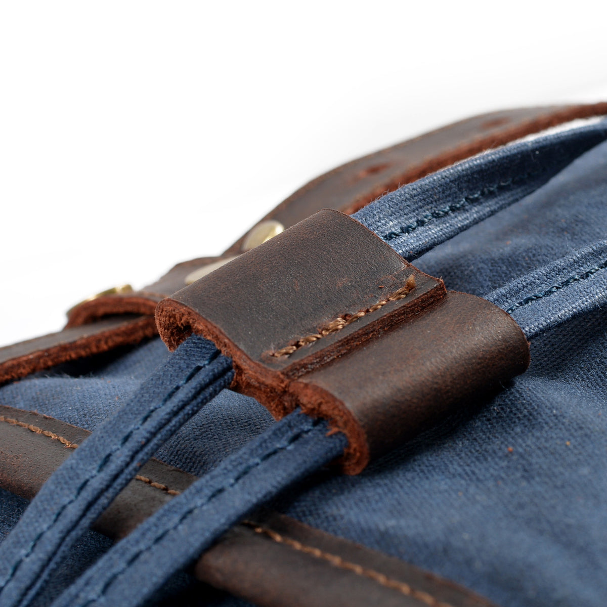 Leather loop and stitching on the blue backpack