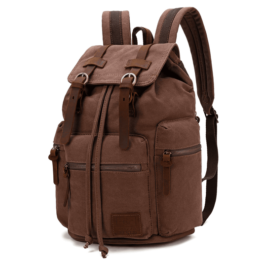 Coffee canvas backpack at an angle with leather buckle straps and zipped side pocket.