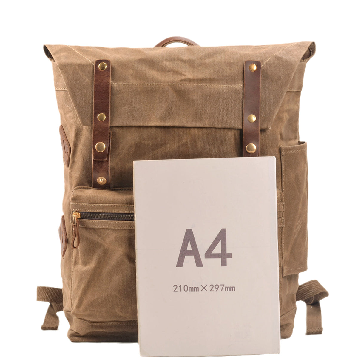 Khaki backpack held against an A4 sheet to show its size
