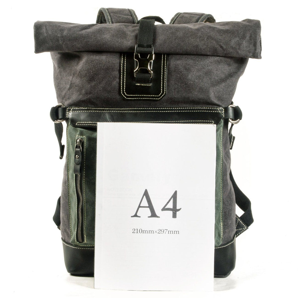 Waxed canvas roll top backpack shown behind an A4 sheet for size comparison