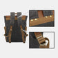 Back of the canvas backpack showing adjustable shoulder straps, woven reinforcement and metal rivets
