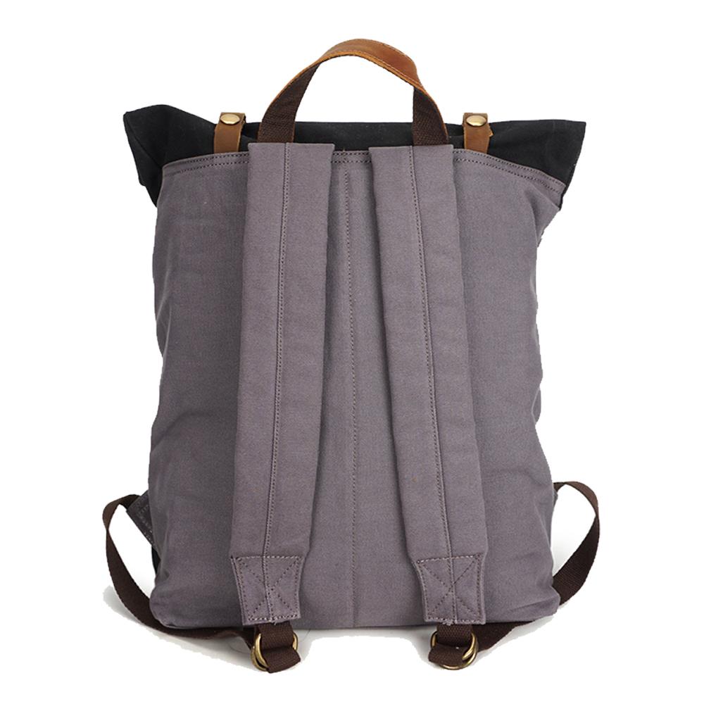 Back of the black backpack with padded shoulder straps and leather top handle