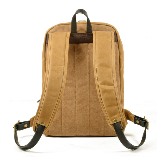 Back of the khaki backpack with padded shoulder straps and leather top handle