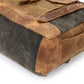 Leather bottom panel and corner of the gray canvas backpack