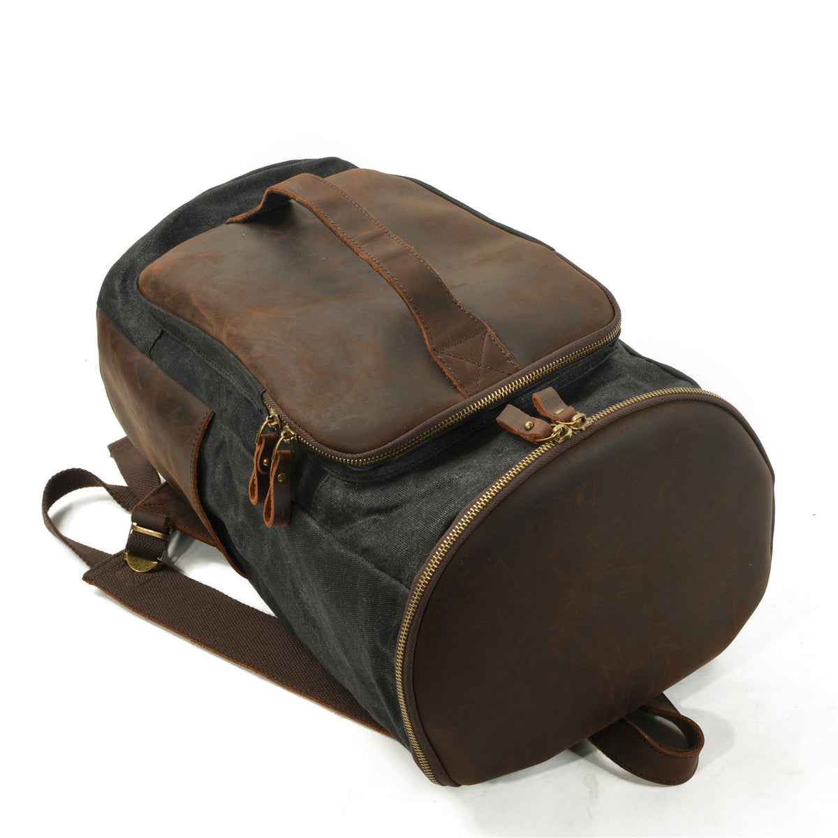 Travel backpack resting flat with its front handle and bottom zipper visible