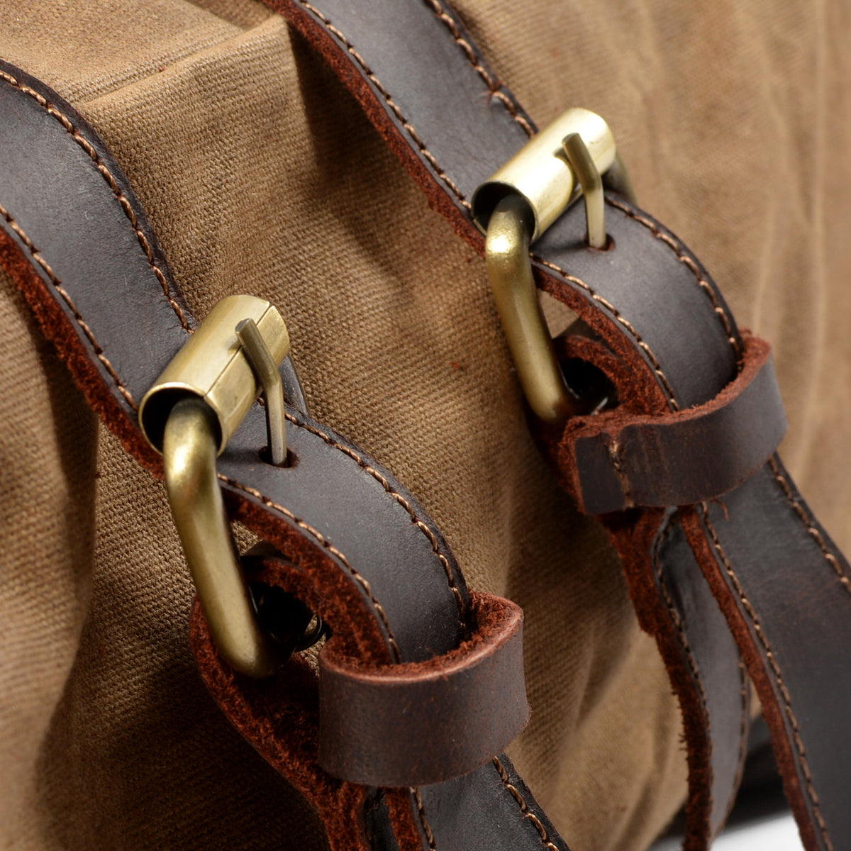 Close-up of brass buckles on the Khaki backpack.