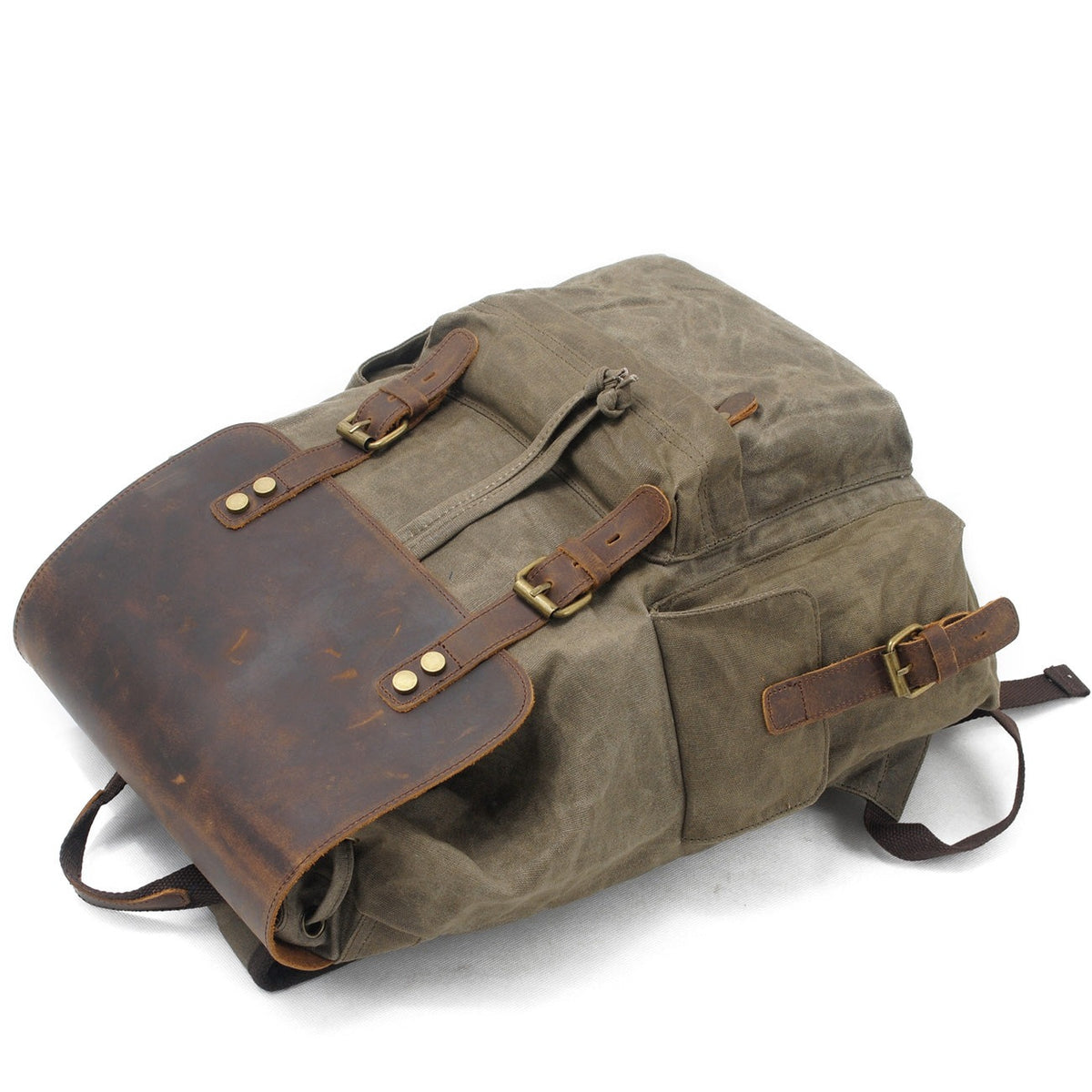 Army waxed canvas backpack with the leather flap buckled.