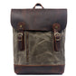Army green water-resistant waxed canvas school backpack with a dark leather flap