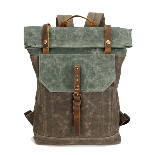 Army green and brown vintage waxed canvas roll top backpack with a leather buckle strap