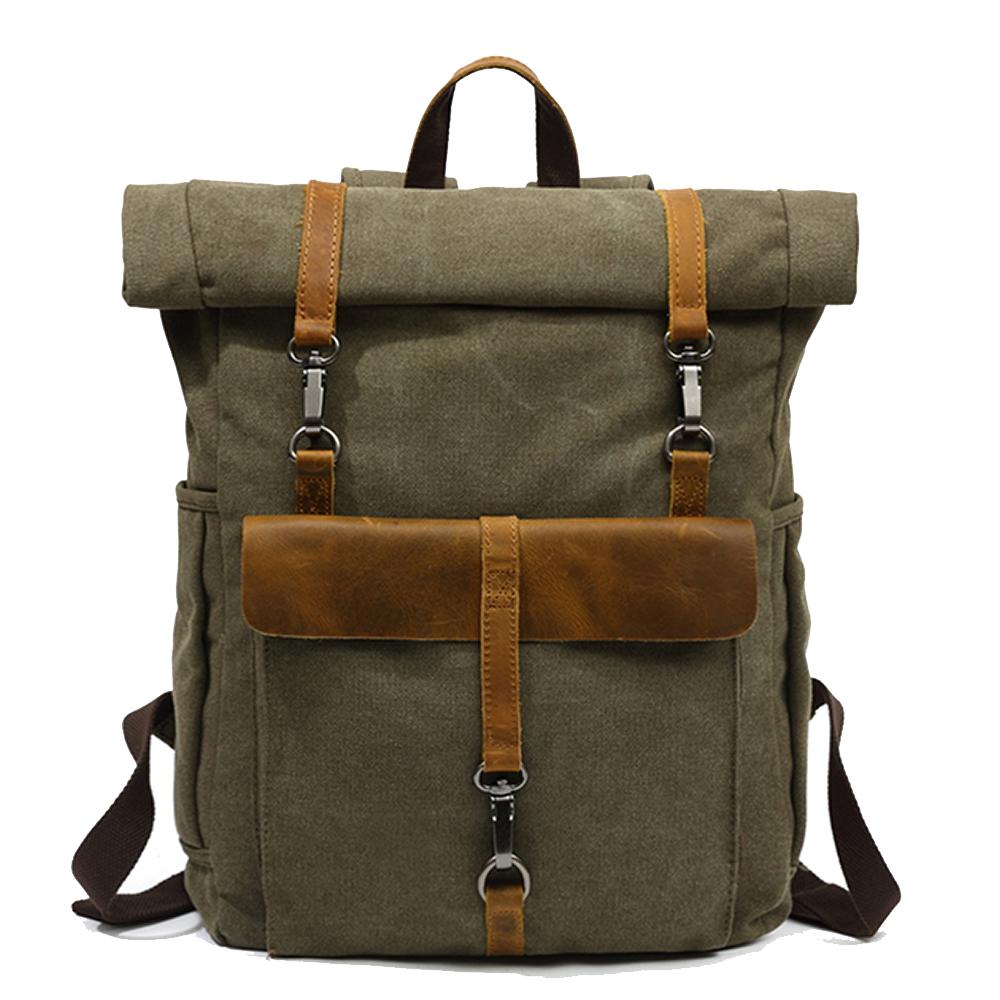 Army green waxed canvas roll top backpack with a brown leather front flap