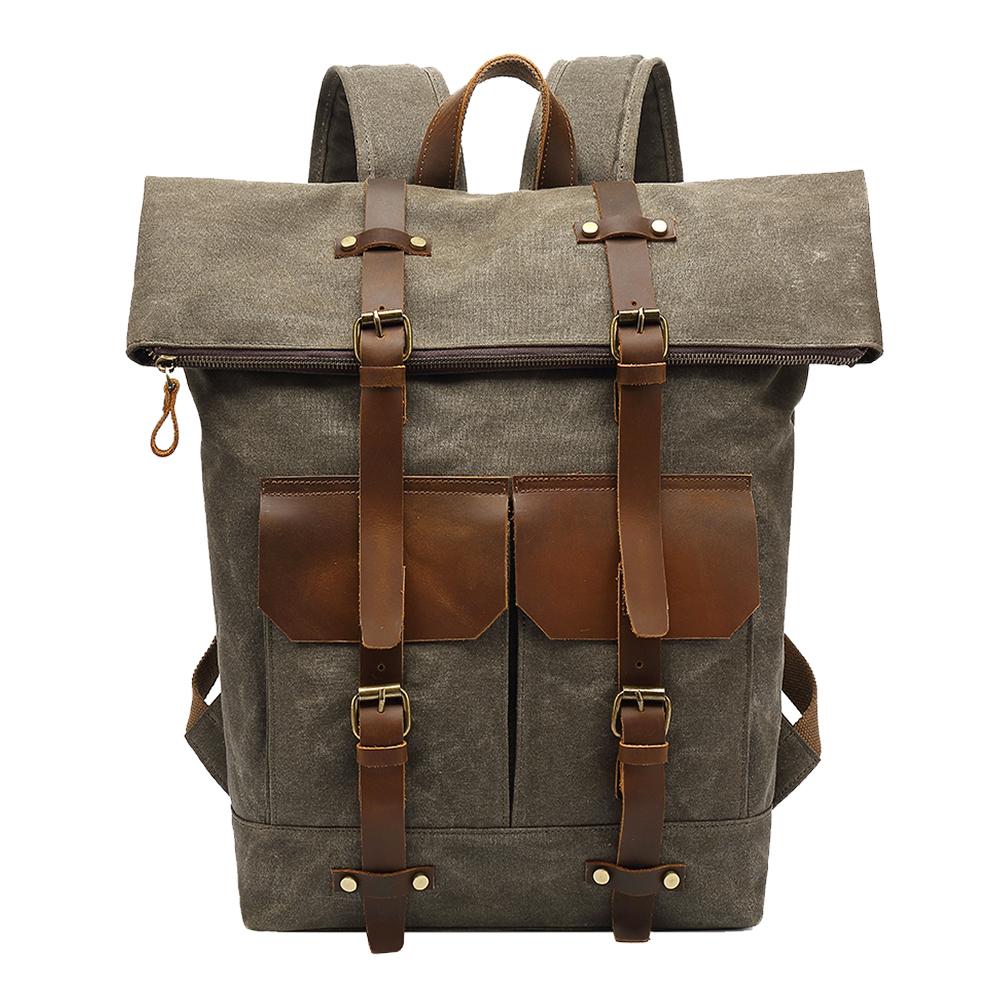 Army green waxed canvas roll top rucksack with leather straps and pockets