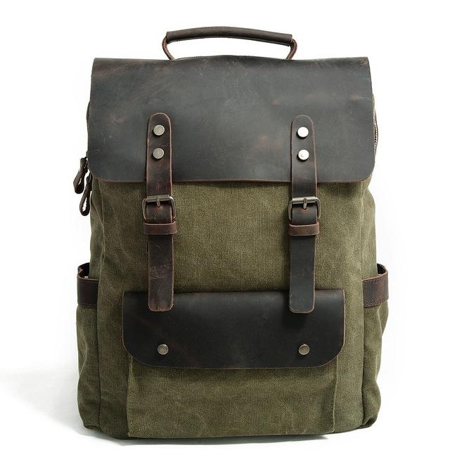 Army green canvas rucksack with a dark leather flap