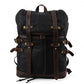 Black vintage waxed canvas laptop rucksack with crazy horse leather straps and brass buckles