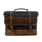 Black waxed canvas messenger bag with a crazy horse leather flap and twin buckle straps