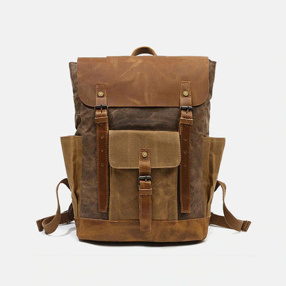 Coffee canvas and leather backpack with a leather flap, front pocket and twin buckle straps