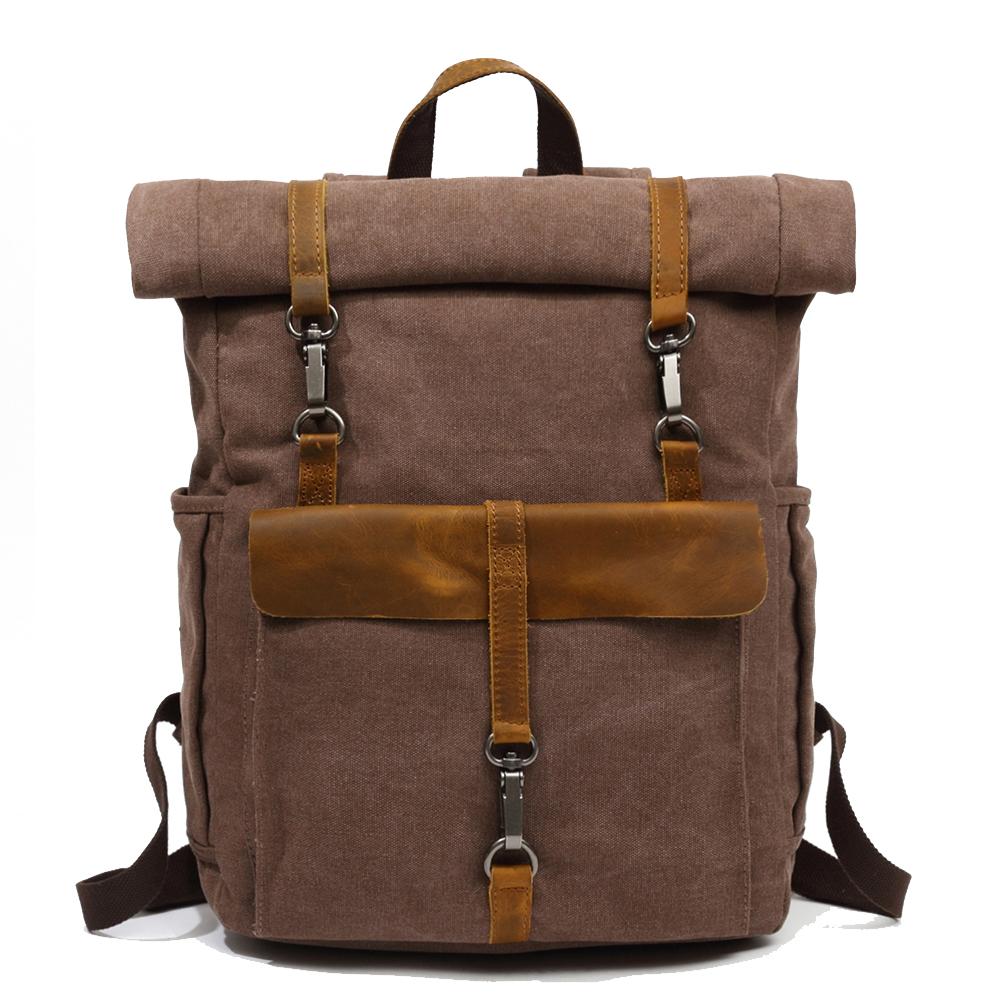 Coffee waxed canvas roll top backpack with a leather front flap and padded straps