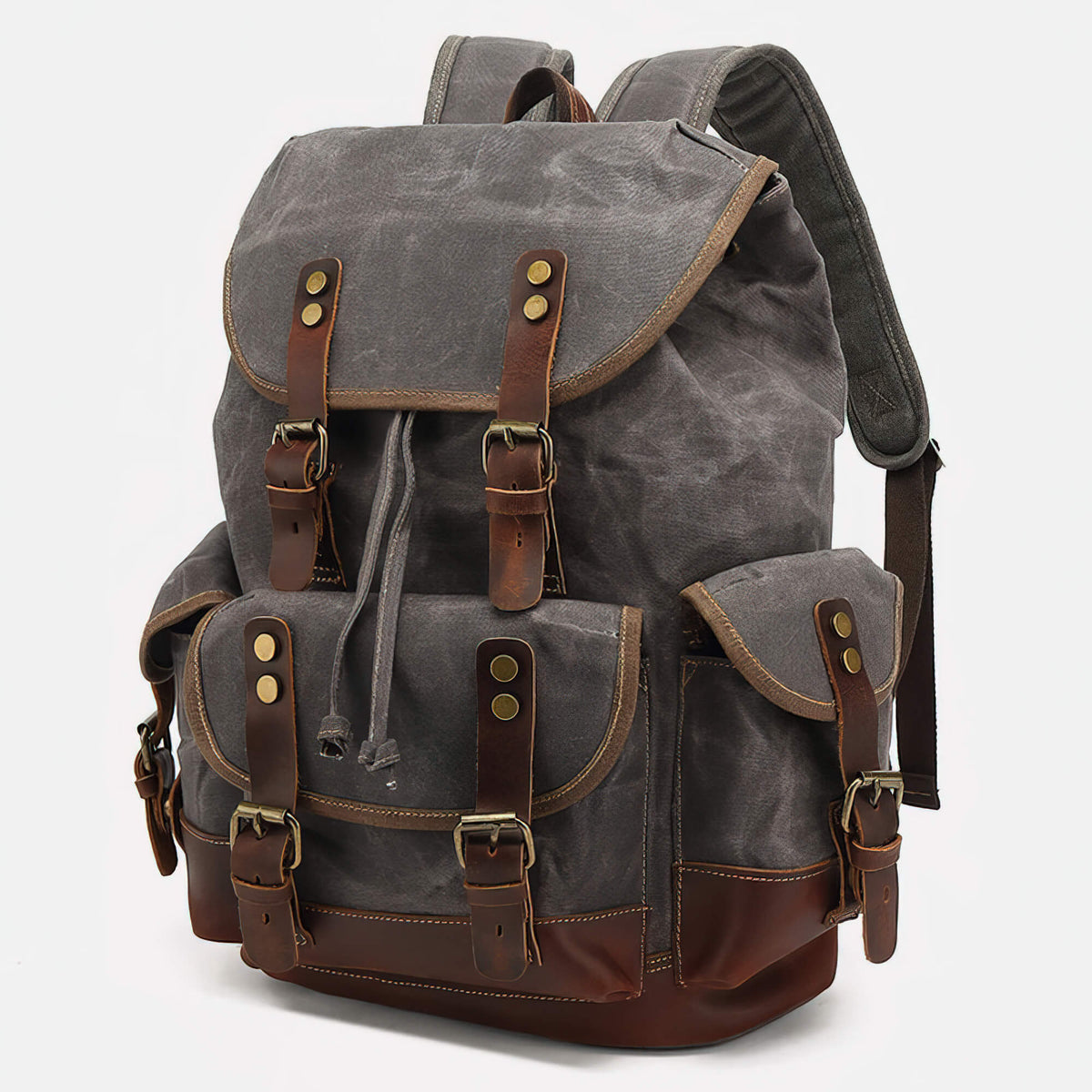 Gray waxed canvas backpack with brown leather straps and two front pockets