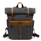 Gray waxed canvas roll top backpack with a crazy horse leather front flap