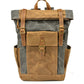 Gray roll top waxed canvas backpack with a leather front pocket