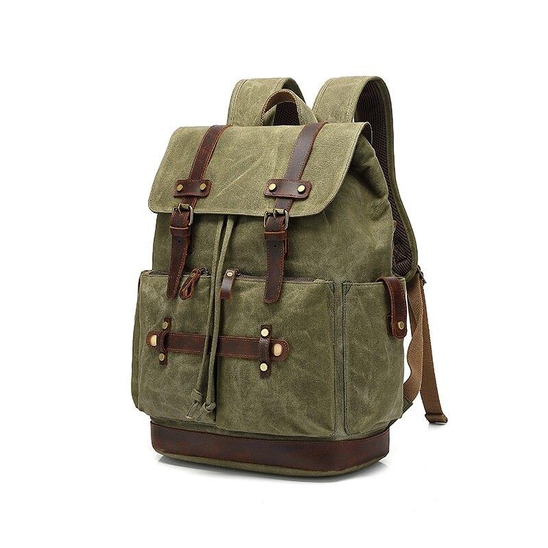 Green military style waxed canvas laptop rucksack with leather straps