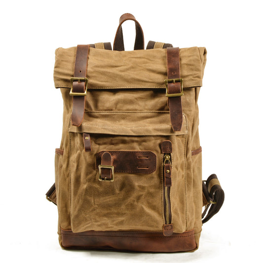 Khaki waxed canvas roll top backpack with leather buckle straps and dual front zippers