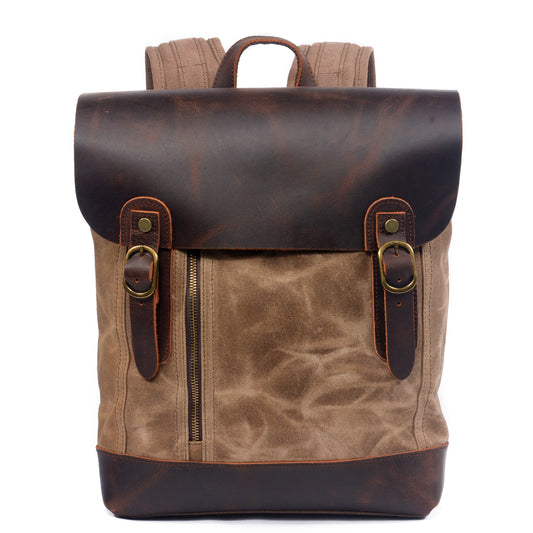 Khaki waterproof waxed canvas school backpack with a full grain leather flap and buckle straps