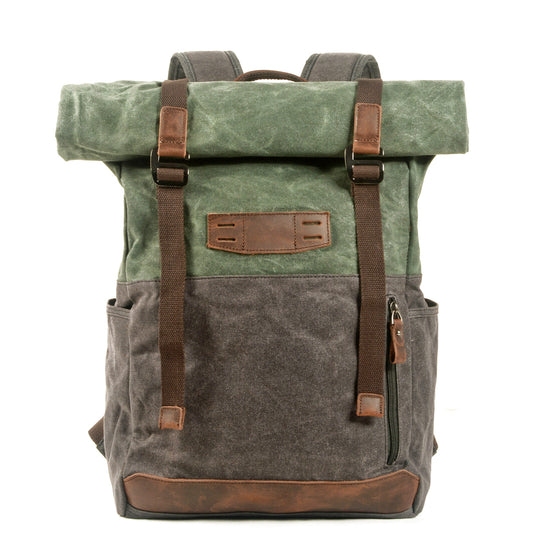 Lake Green waxed canvas roll-top backpack, front view with webbing straps and leather trim