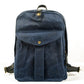 Navy waxed vintage canvas school backpack with a snap front pocket and leather top handle
