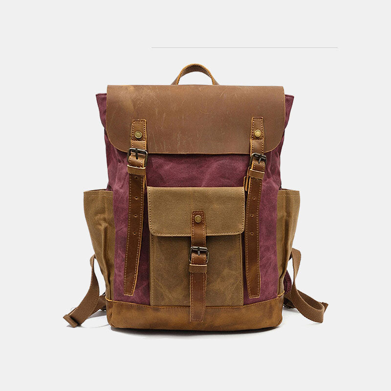 Rose canvas backpack with a leather flap, twin buckle straps and a front pocket