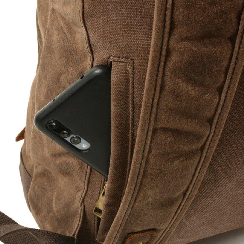Phone tucked into the backpack's rear zip pocket beside a shoulder strap
