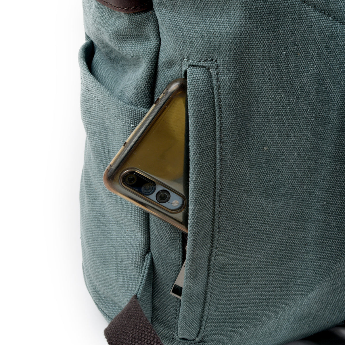Rear pocket unzipped to show a phone beside the padded strap