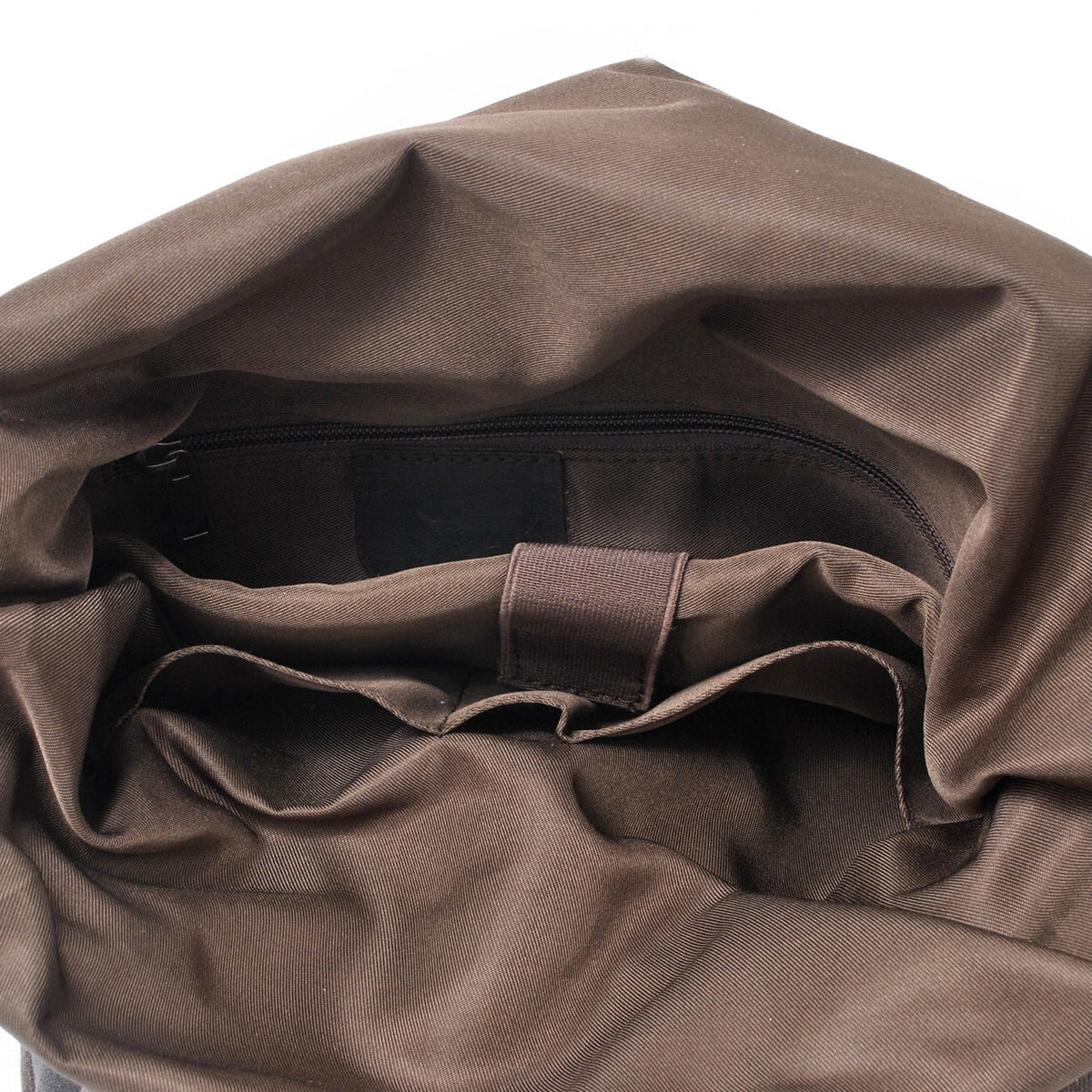 Brown lining and slip pockets inside the roll top compartment