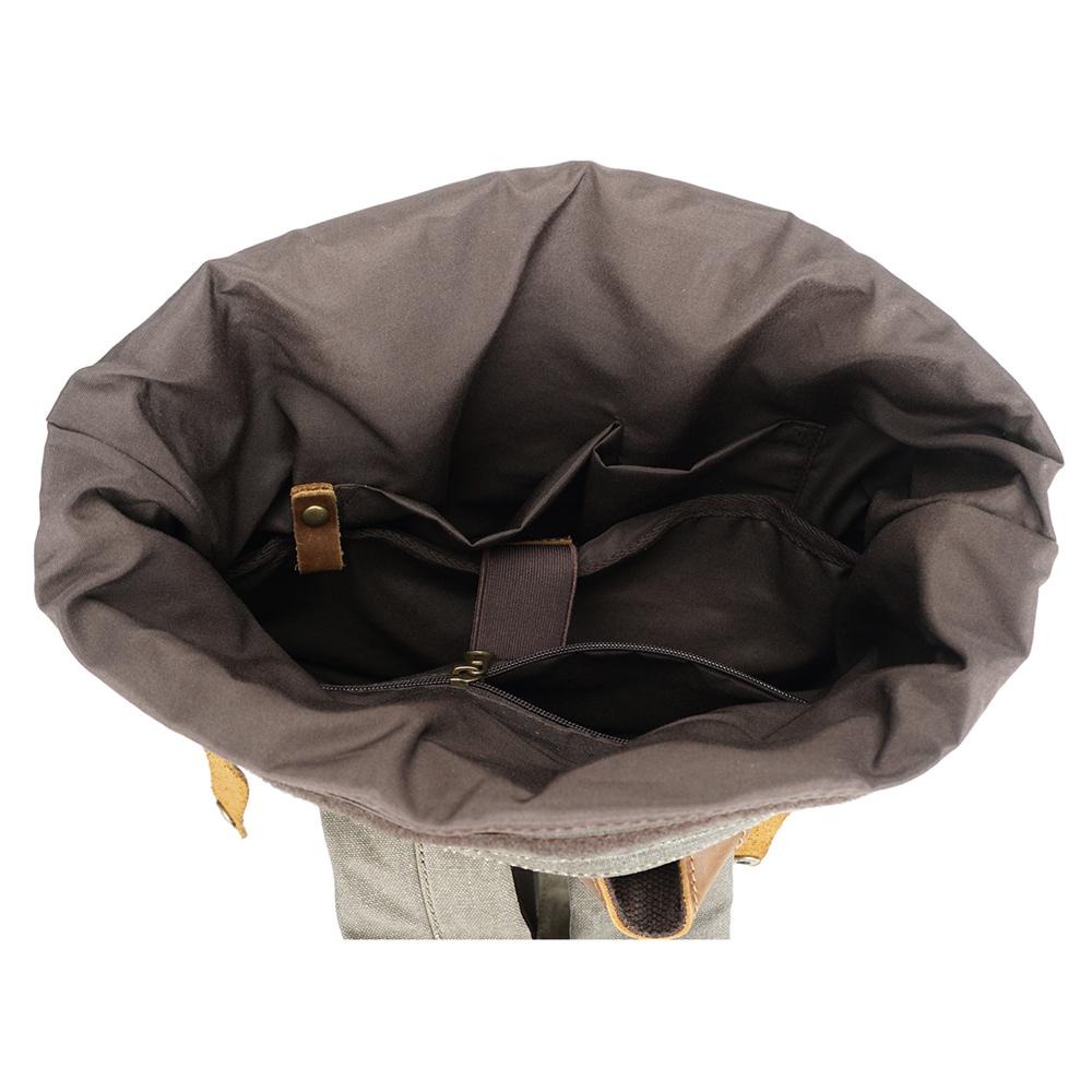 Open roll top compartment with a gray lining and inner slot pockets