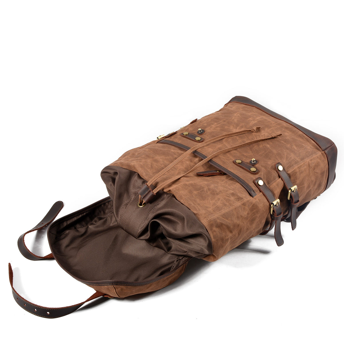 Brown waxed canvas rucksack with the drawstring top open, showing its empty interior.