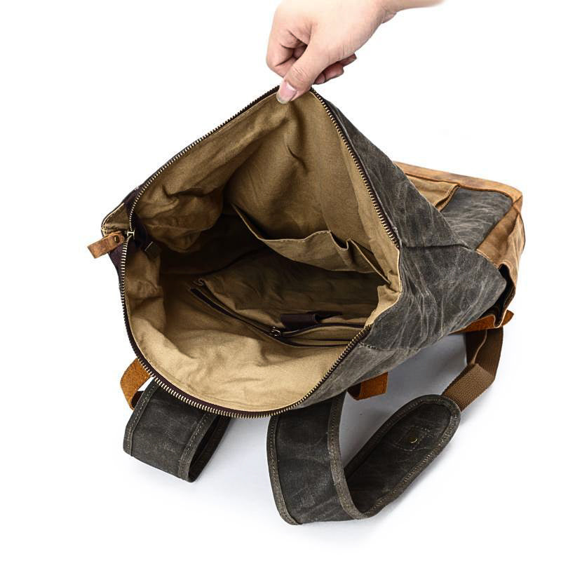 Gray backpack interior showing the beige lining and inner pocket.