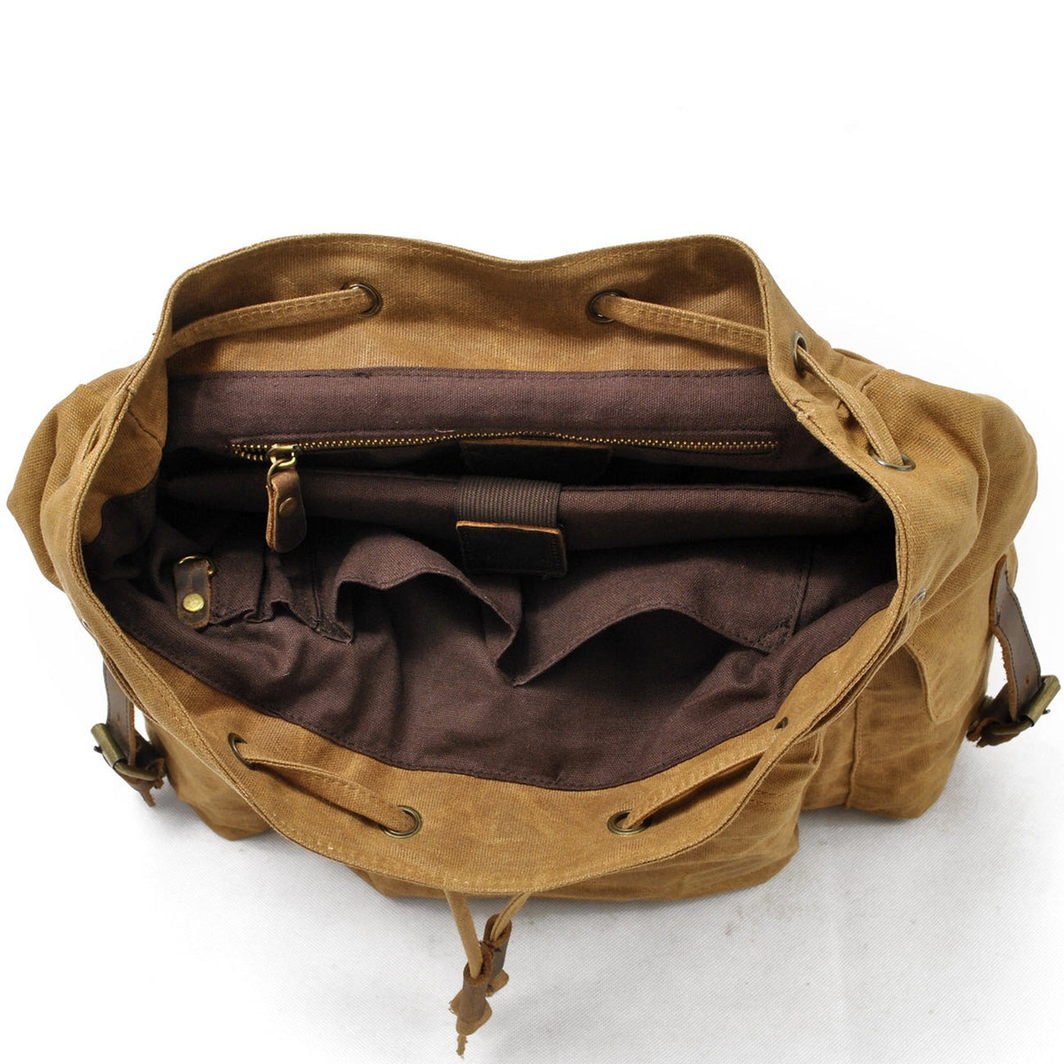 Khaki backpack interior showing the open drawstring compartment.