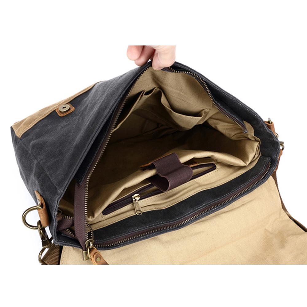 Open messenger bag showing the padded laptop sleeve, fastening strap and interior pockets
