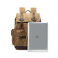 Khaki rucksack beside a laptop to show the fit for most 15.6 inch laptops