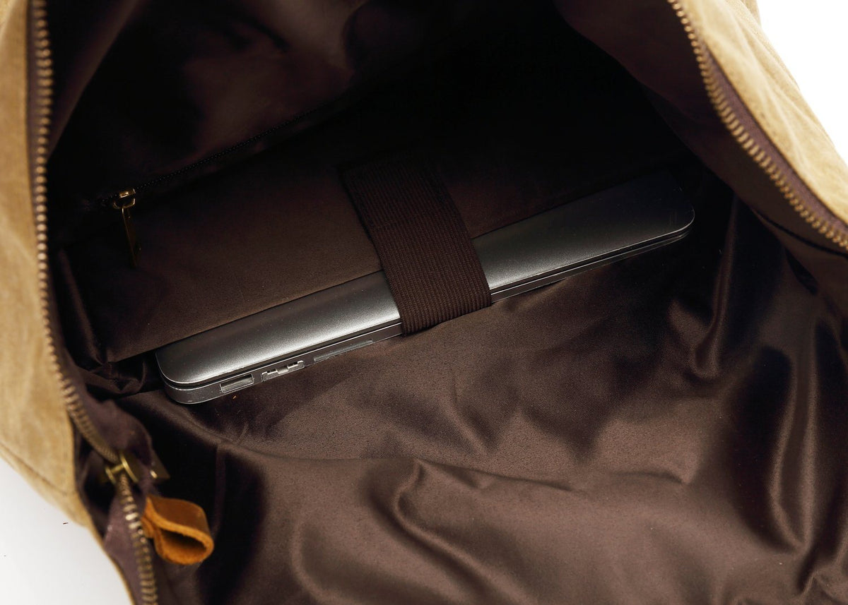 Laptop tucked into the padded sleeve inside