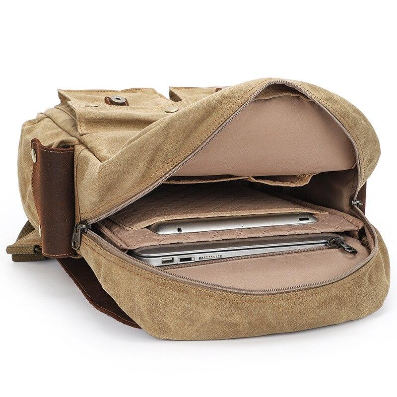 Camera backpack opened flat to show a laptop in its padded sleeve