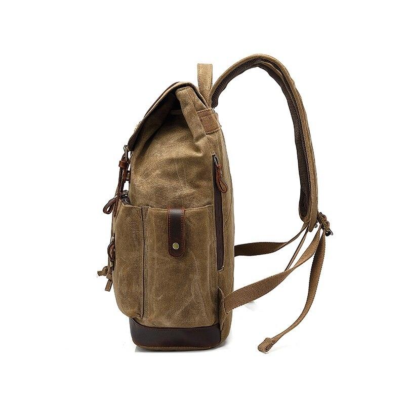 Left side of the waxed canvas rucksack showing its bottle pocket and padded shoulder strap.