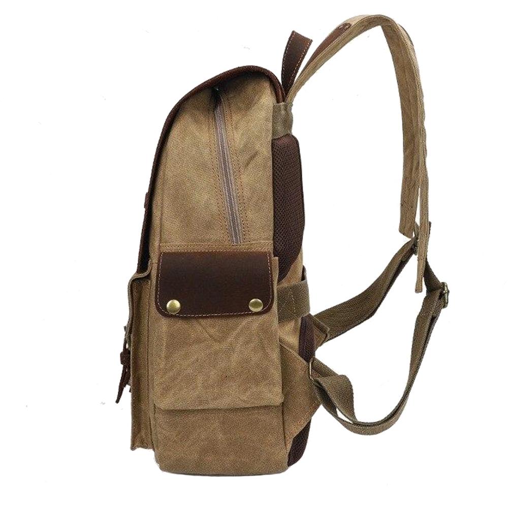Left-side view of the Khaki camera backpack showing its zipper opening and leather pocket.