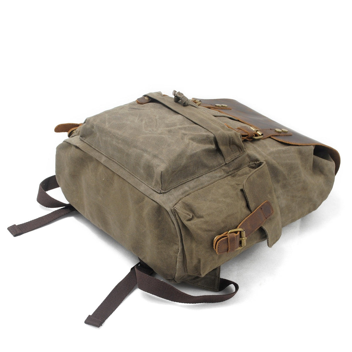 Army waxed canvas backpack showing its exterior side pocket and leather buckle.