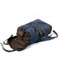 Blue rucksack with the flap folded back and drawstring open