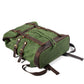 Army waxed canvas rucksack with the roll top closed and leather straps fastened.