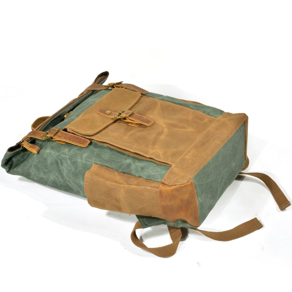 Lake green backpack lying on its back with the roll top closed