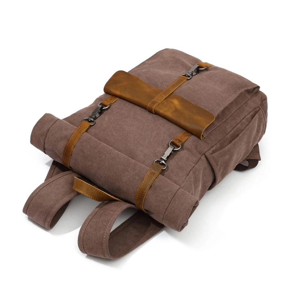 Coffee roll top backpack lying flat with the leather front strap