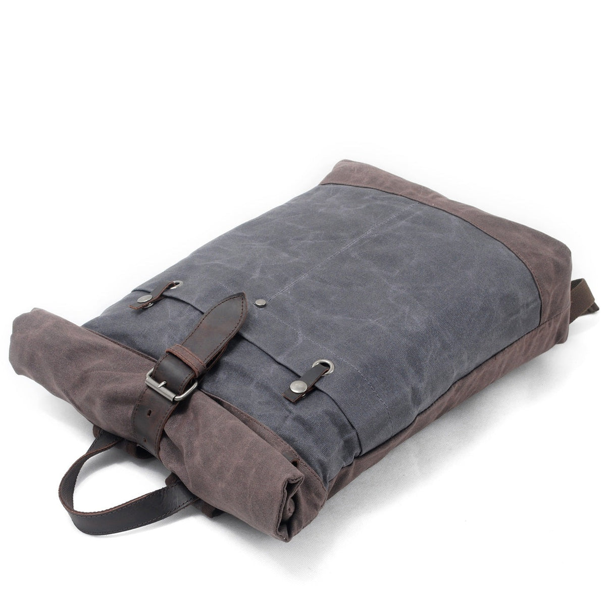 Gray roll top backpack lying flat with the buckle strap fastened